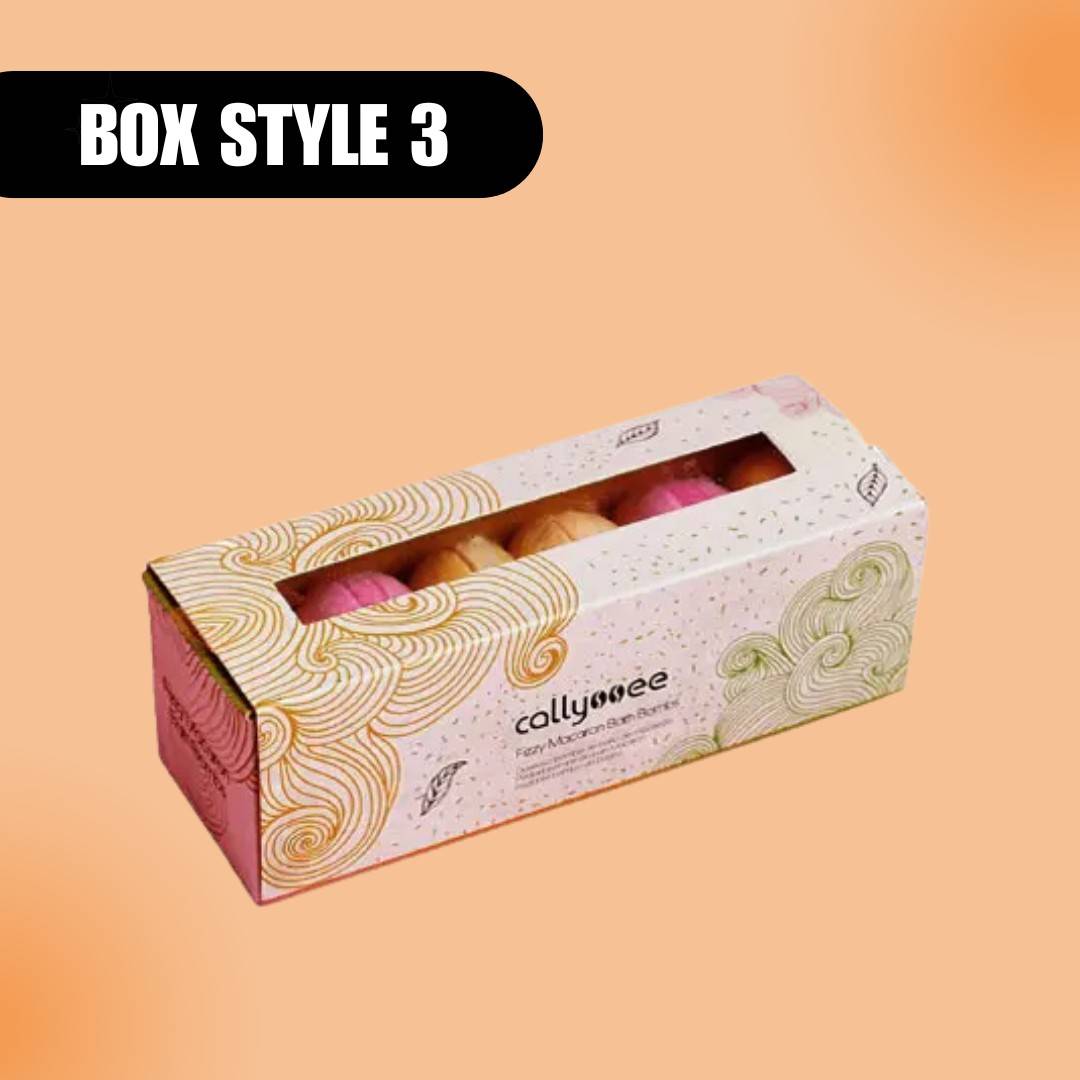 Packaging labeled "Box Style 3" features colorful swirled patterns and houses pastel macarons, conveying an elegant and whimsical tone.